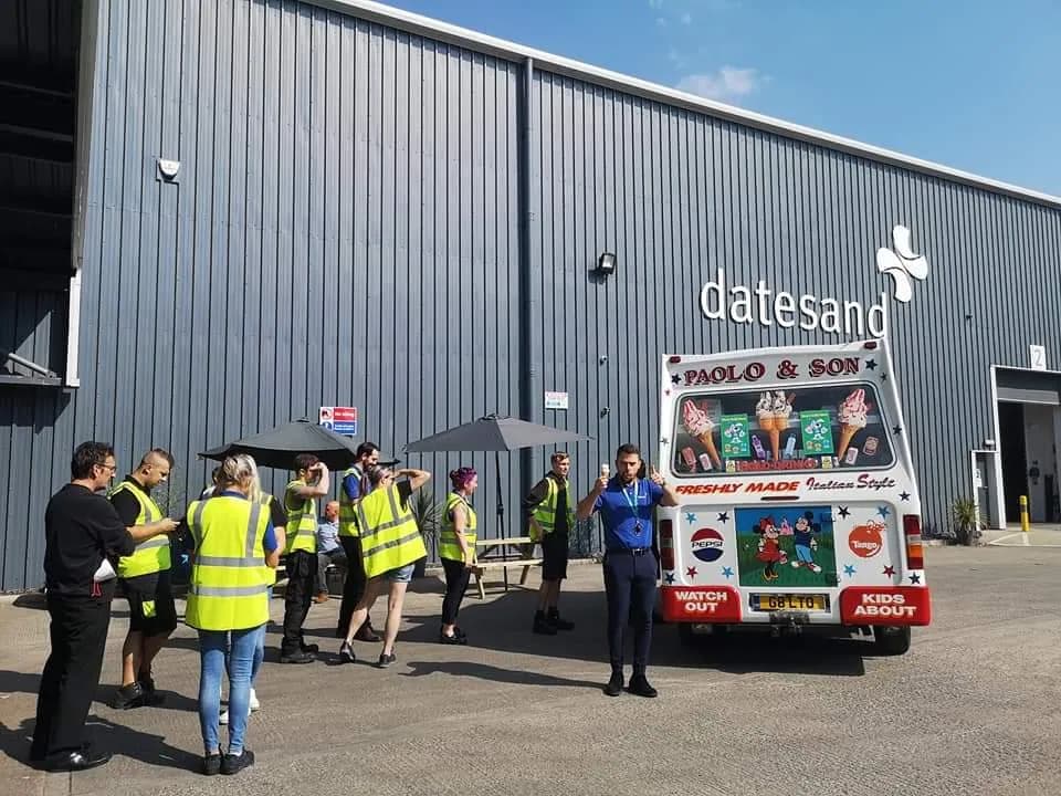 Whippylicious ice cream van at a corporate event in Manchester — staff in hi-vis enjoying cones